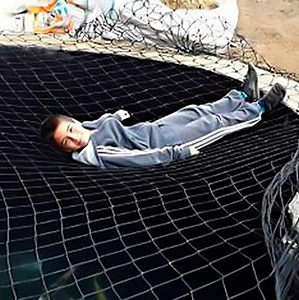 Child safe pond net cover with child safely on top